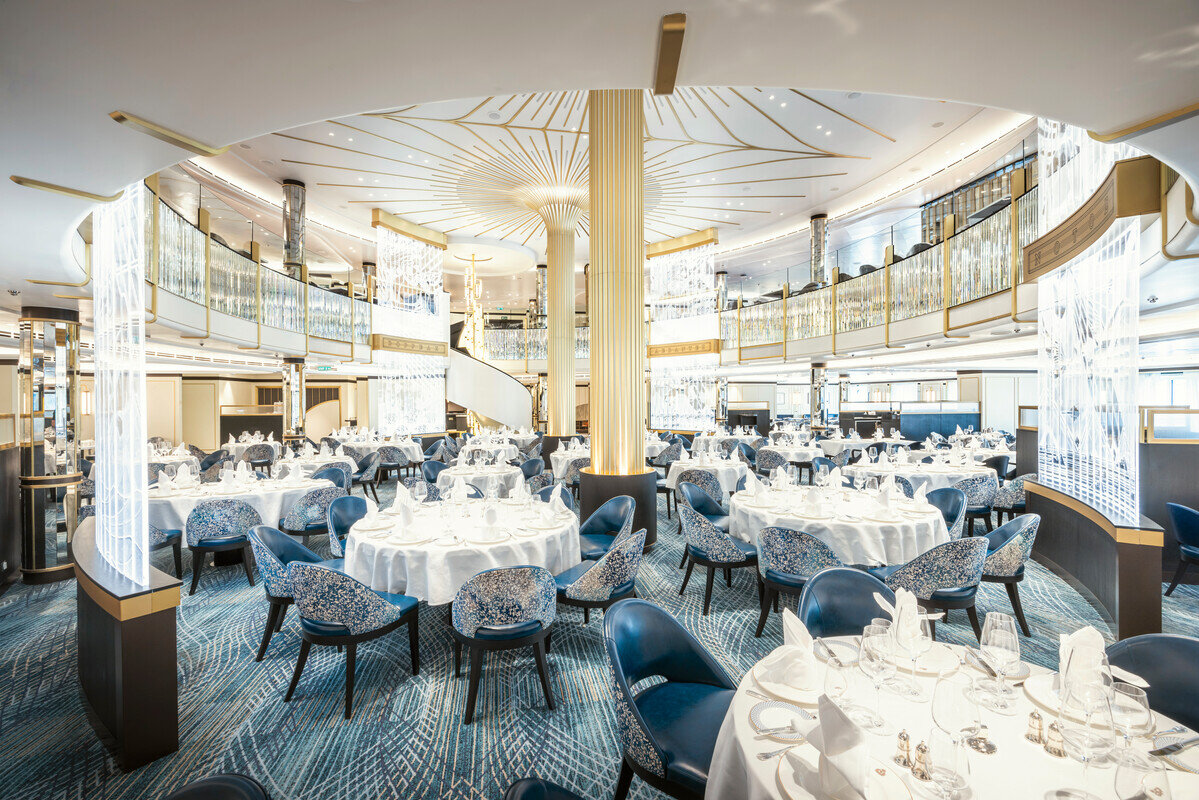 The Britannia Restaurant on Cunard's Queen Anne laid for dinner