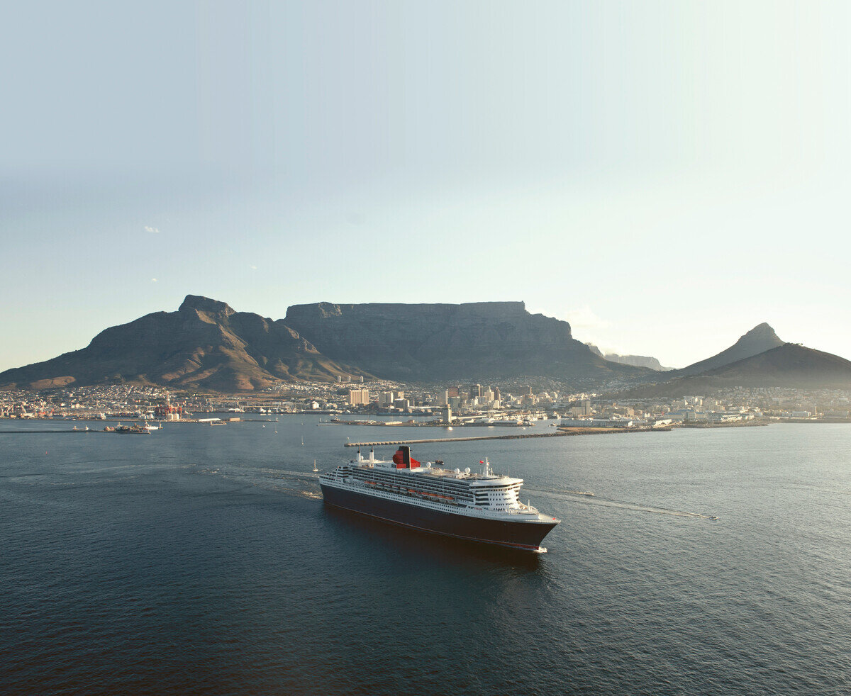 Queen Mary 2 sailing past Table Mountain into Cape Town