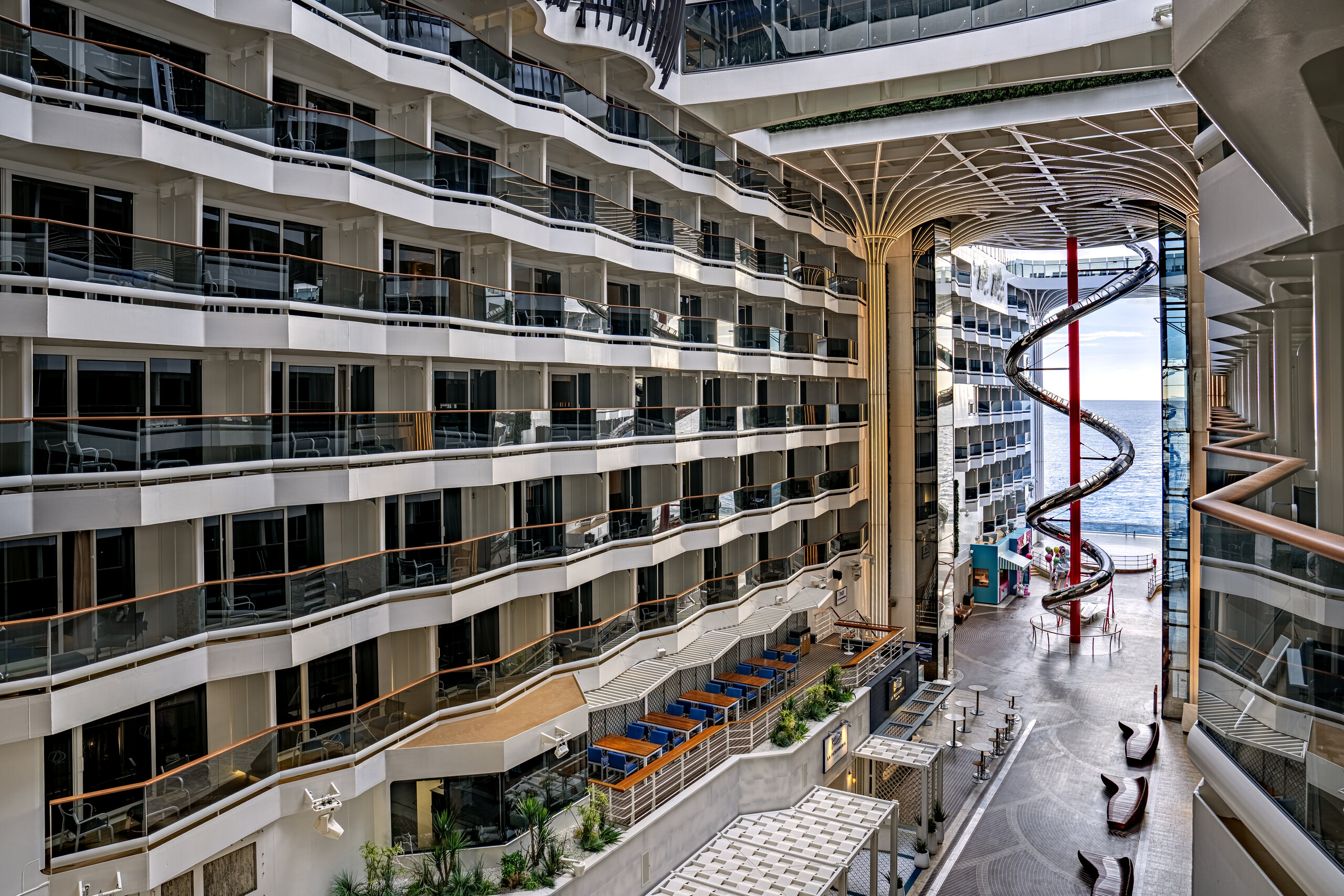 The World Promenade lined with balcony cabins on an MSC World Class ship