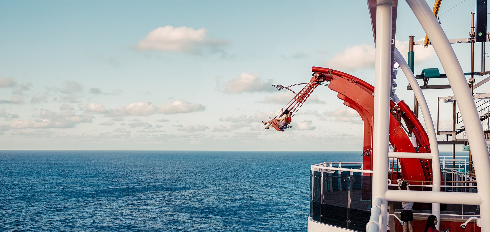 The Cliffhanger swing ride extending out over the sea on MSC World America