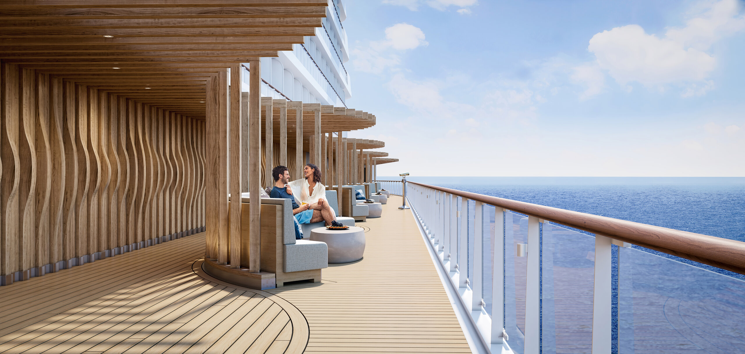 Guests at a table on Ocean Boulevard, the open-air deck on Norwegian Prima